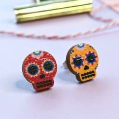 Mismatched sugar skull earrings
